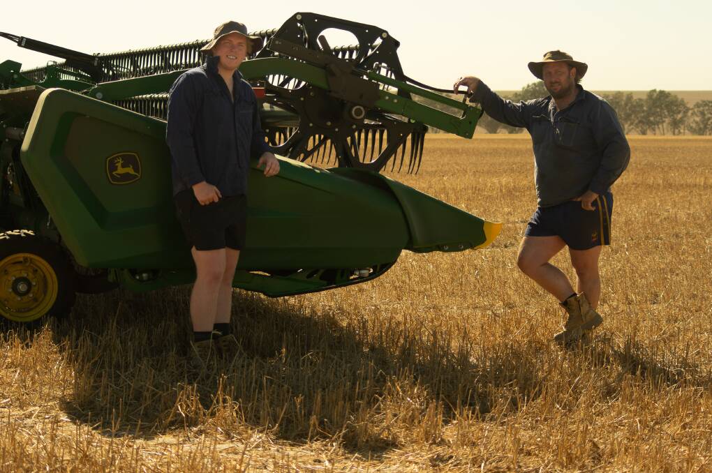 After saving an estimated 200 hours, Allanooka farmer Daniel Winter (right) said he wouldnt hesitate in recommending the John Deere X9 1100 Combine Harvester to other farmers. He is with son Jack.
