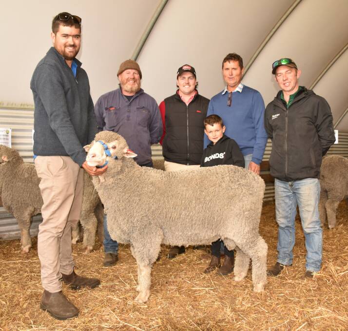 Hiview's Chad Corker holds the $3000 top-priced ram at the Hiview on-property sale at Kulikup on Monday. With him were buyer Wayne Girando, Dinninup, Elders, Kojonup representative Liam Wants, Hiview stud co-principal Perry Corker, Rory Corker (7) and Nutrien Livestock and Wool, Boyup Brook agent Matthew Chambers, who bid on the ram.