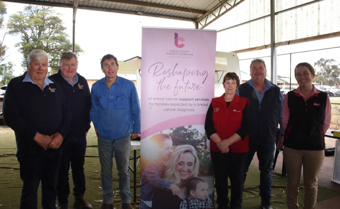 Two studs at the Williams Breeders' Ram Sale, Auburn Valley and Iveston, supported the Shearing For Liz Pink Day fundraiser charity for Breast Cancer Research - WA and celebrating the more than $1600 raised were Auburn Valley principals Peter (left) and Jeffrey Rintoul, Iveston buyer Phil Martin, Williams, Iveston principals Debbie and Grant Bingham and Elders stud stock representative Lauren Rayner.