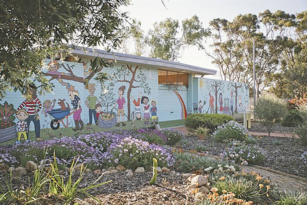 Art is a feature of the community garden.
