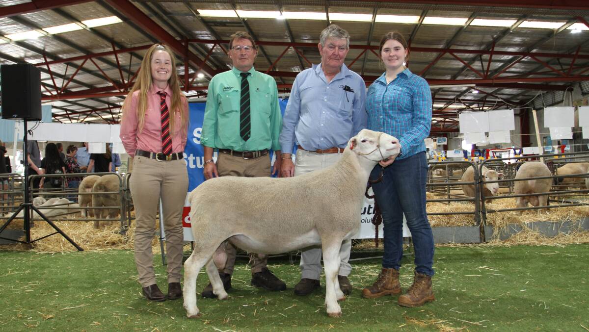 With the $5600 top price Shirlee Downs White Suffolk ram purchased by the Ditchburn family, Golden Hill White Suffolk Stud, Kukerin, were Lauren Rayner (left), Elders stud stock, Nutrien Livestock breeding's Roy Addis who represented the buyers and Shirlee Downs stud co-principal Chris Squiers and his granddaughter Stella Squiers, Quairading. 