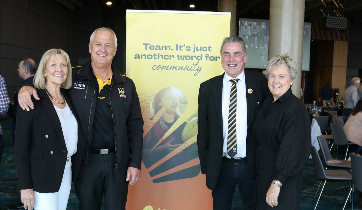 CFWA vice president Ian Stanley (left) and his wife Robyn and outgoing president John Shadbolt and his wife Debbie, with one of the new CFWA banners showing its new logo.