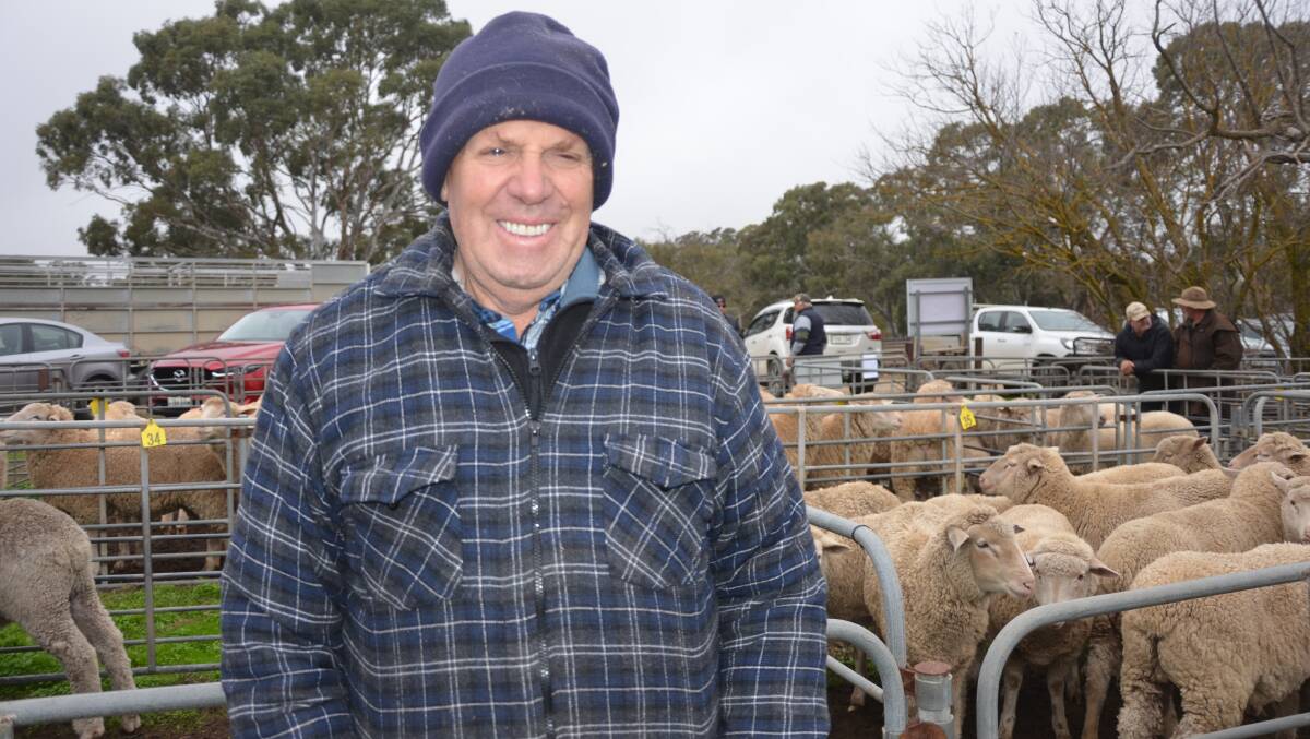 CHECKING OUT PRICES: Alan Kroehn, Springton, SA, was at a recent sheep and lamb market at Mount Pleasant, SA.