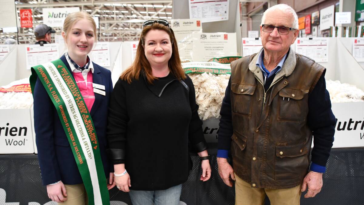 INTERSTATE: Maddi, Erica and Phil Venning, Clare, SA, with their most valuable fleece awarded at the Australian Sheep & Wool Show.