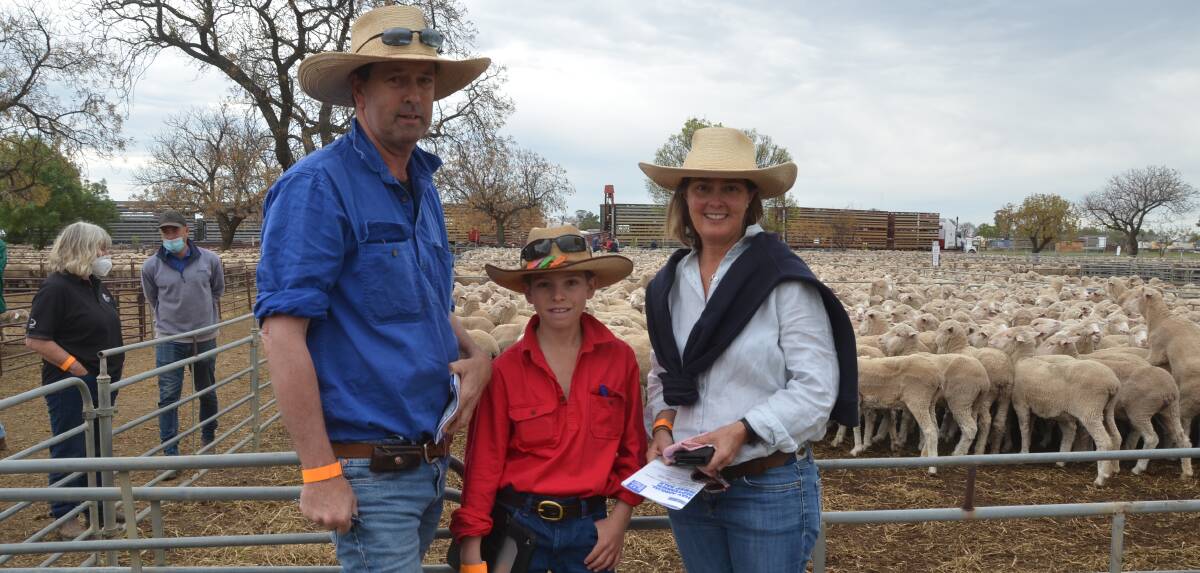 BUYING: Ben, James, 11, and Catherine Cruikshank, Merryvale, Ganmain, NSW, purchased 330 Merino ewes for $265 at Hay, NSW, last week.