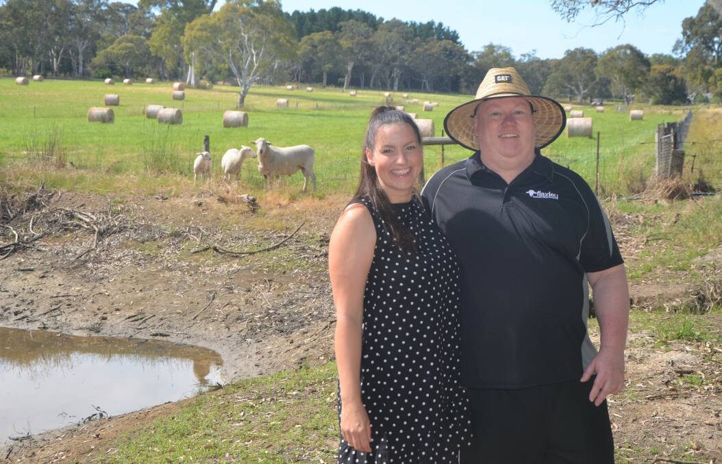 RECORD RAM: Natalia and David Ellingsen at their Flaxley property which is home to 'White Gold' (in background), the record $165,000 Australian White ram.