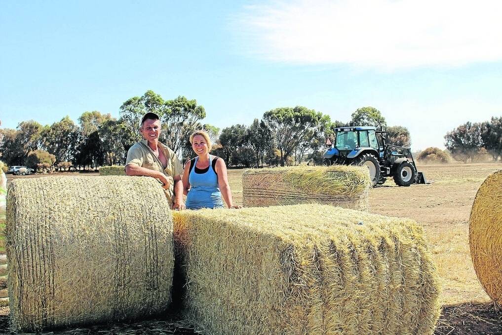 Locals Donna and Mike Warmsley, who are coordinating the pick up of the fodder to the local dairy and cattle producers affected by the blaze.