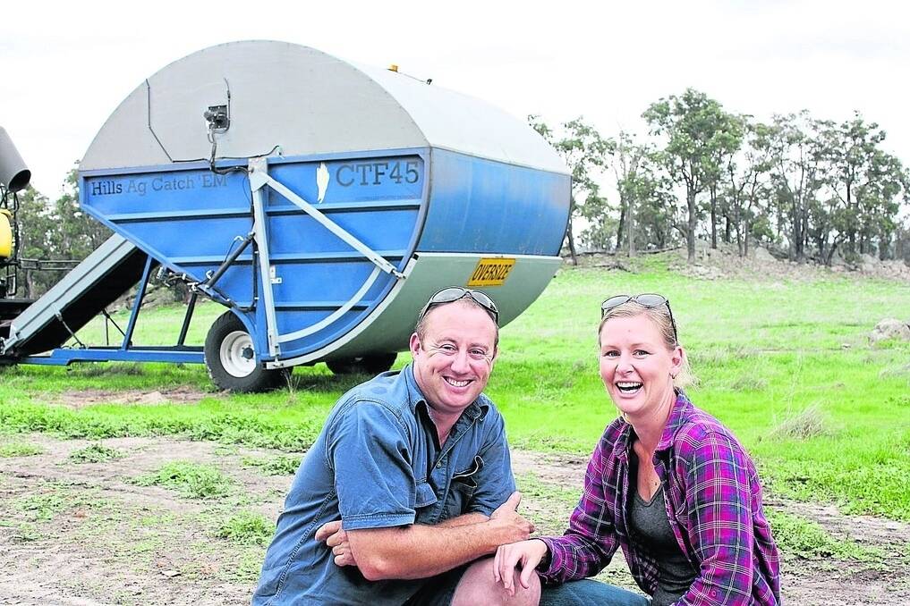 Kojonup farmers Peter and Emily Hills in front of their latest "pride and joy", a chaff cart called the Catch Em.