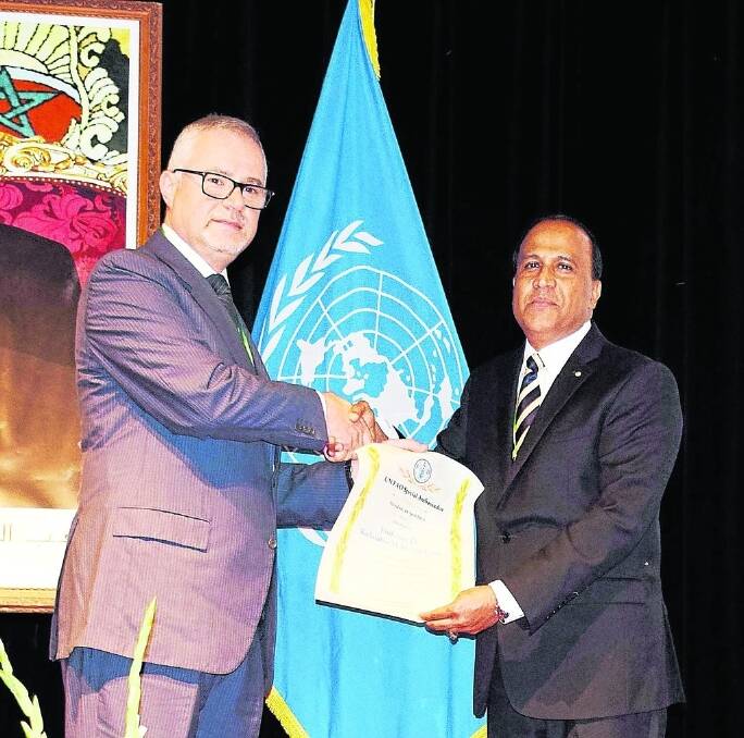 Kadambot Siddique (right), director of the University of WA&#39;s Institute of Agriculture, was designated a United Nations Food and Agriculture Organisation special ambassador for pulses in Marrakesh last week, in recognition of his research involving legumes.