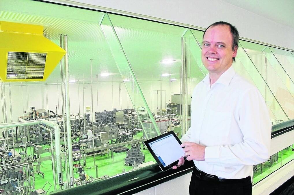 Operating in a virtual world, Brownes Dairy information technology manager Brad Flintoff can monitor and control factory operations on his iPad from anywhere in the Balcatta plant.