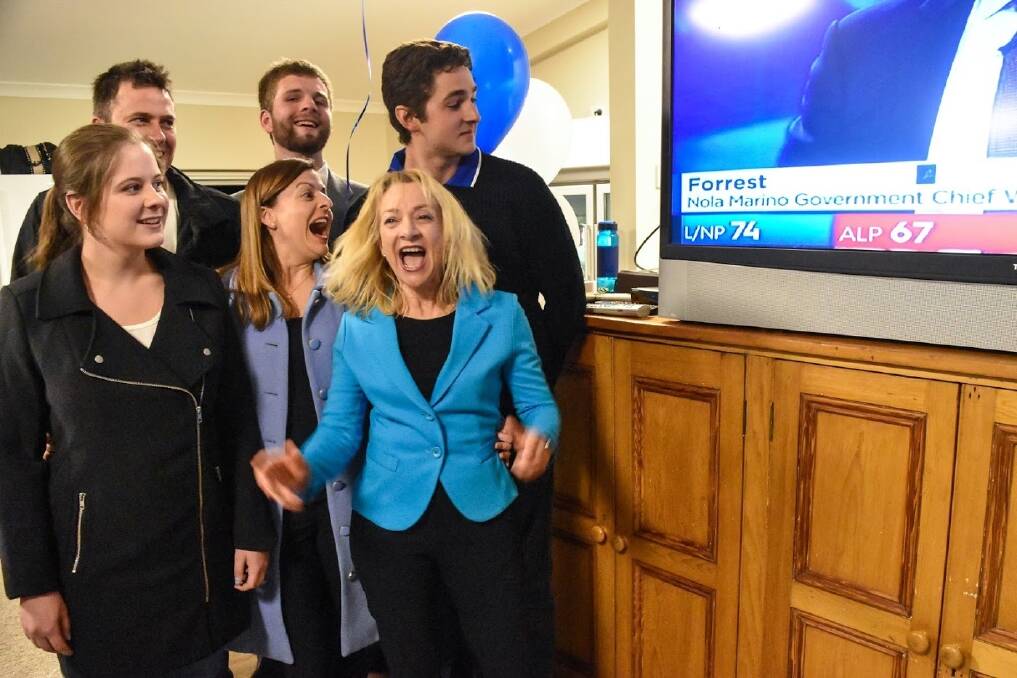 Nola Marino celebrates with supporters the moment live television coverage of the electorate showed her result.