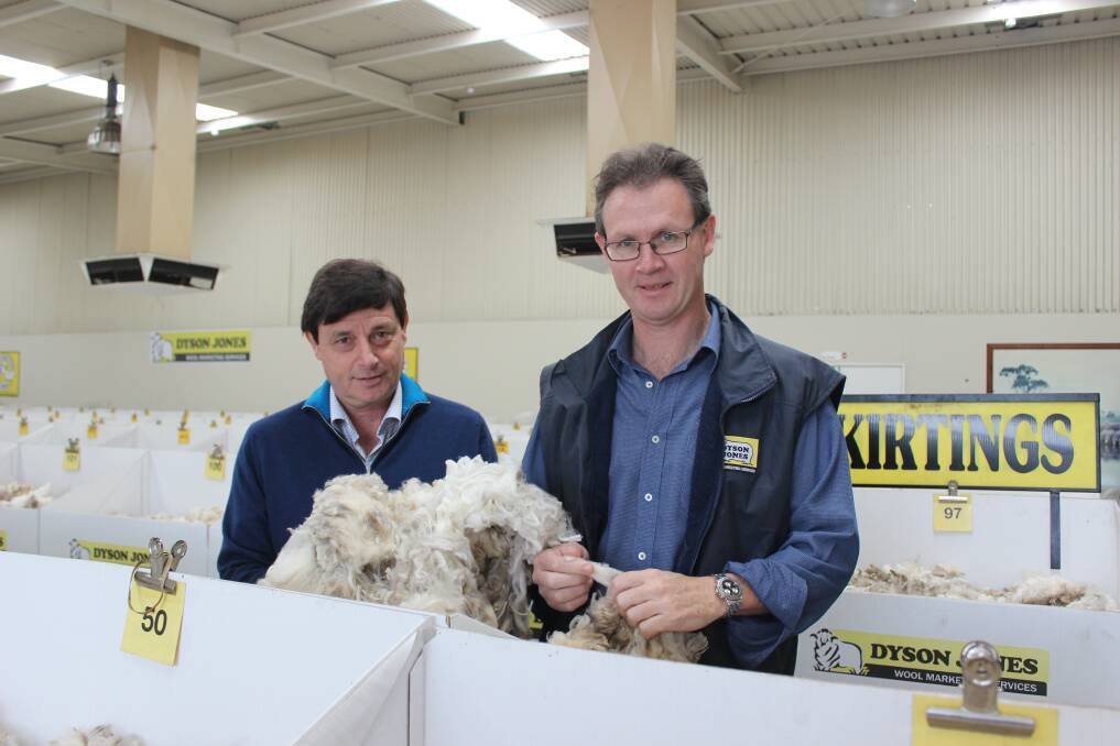 John Colley and Peter Howie inspecting wool on the Dyson Jones show floor last week.