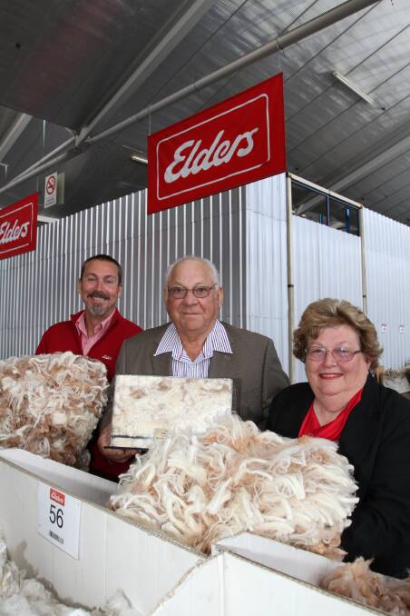 Elders WA wool manager Danny Burkett (left), congratulates Bob and Jacque Panizza, Old Aprelia Merino and Poll Merino stud, Southern Cross, on the family's 50th consecutive wool clip sold through Elders last week.
