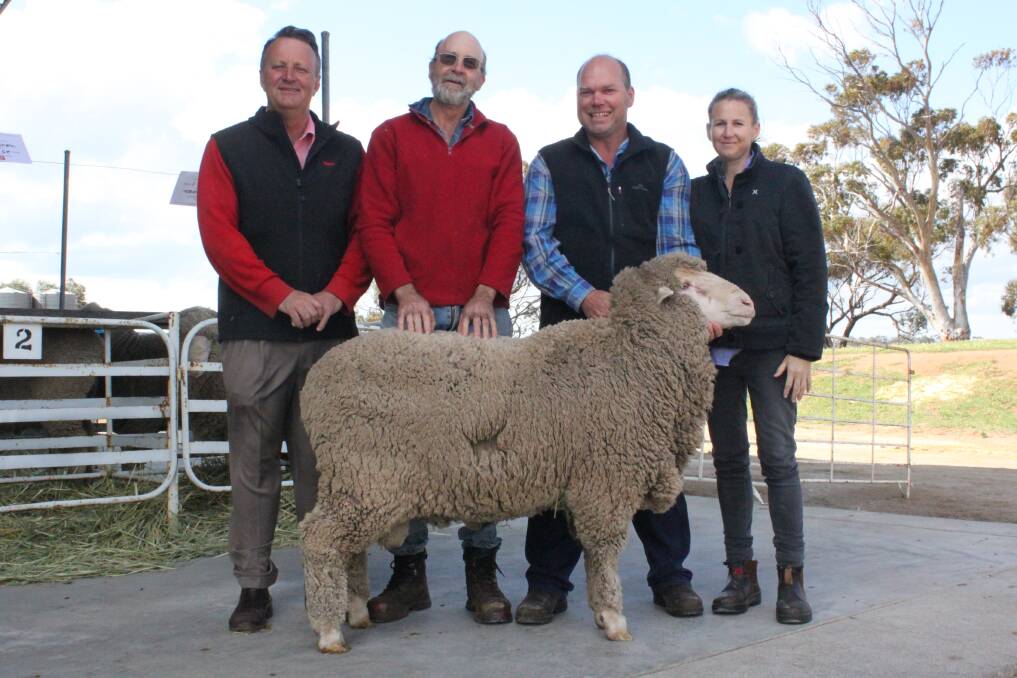 Elders auctioneer Roger Fris (left), buyer Peter Stewart, Irishtown and Grass Valley stud principals Grant and Amy Park with the top-priced $2000 Poll Merino ram at the Grass Valley Poll Merino on-property ram sale last week.