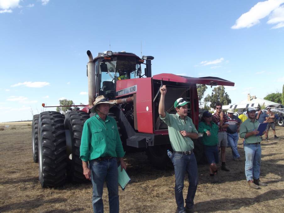 Landmark auctioneer Michael Altus (centre) with Rex Luers, Landmark agent Kellerberrin on his right and co-auctioneer James Culleton, Corrigin, on his left, knocked down the Case International 9390 for the day's top price of $66,000.