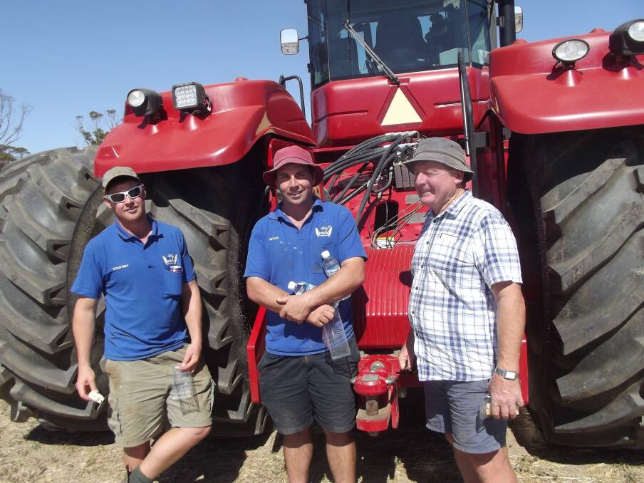 Checking the Versatile 535 tractor before the start of the McGellin sale were Courtney (left), Regan and Harley Bairstow, Dumbleyung. It was passed-in when bidding failed to reach the reserve price.