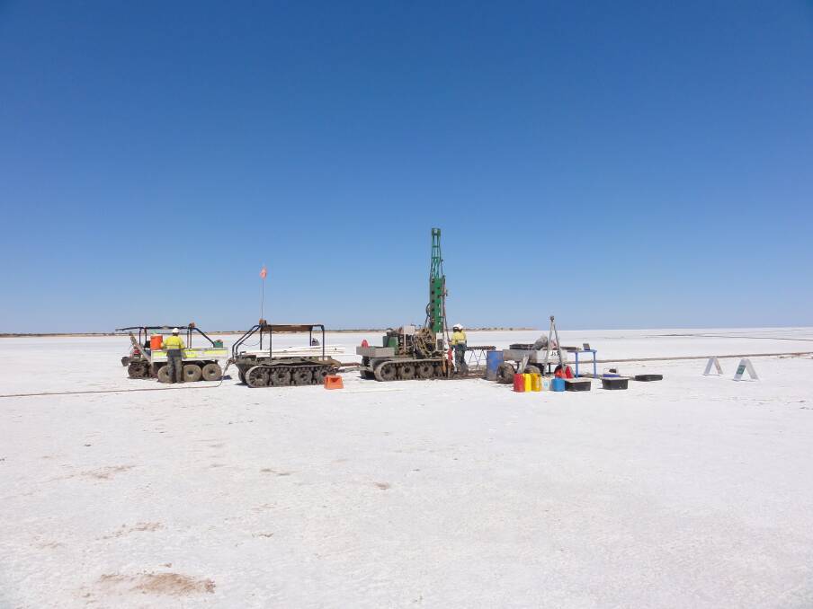 Workers drilling test bores at Lake Mackay, straddling the WA and Northern Territory border, to prove up the potassium-rich brine resource Agrimin Ltd plans to process into high-value Sulphate of Potash fertiliser. AustralianSuper, Australia's biggest industry superannuation fund, has invested in the project.