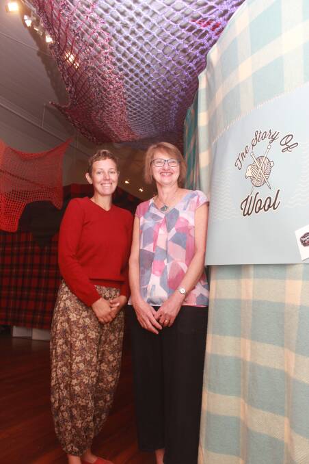 Curator of the Story of Wool exhibition Annette Davis (right), with assistant Tess Bryant at the entry to the exhibition at the Vancouver Arts Centre.