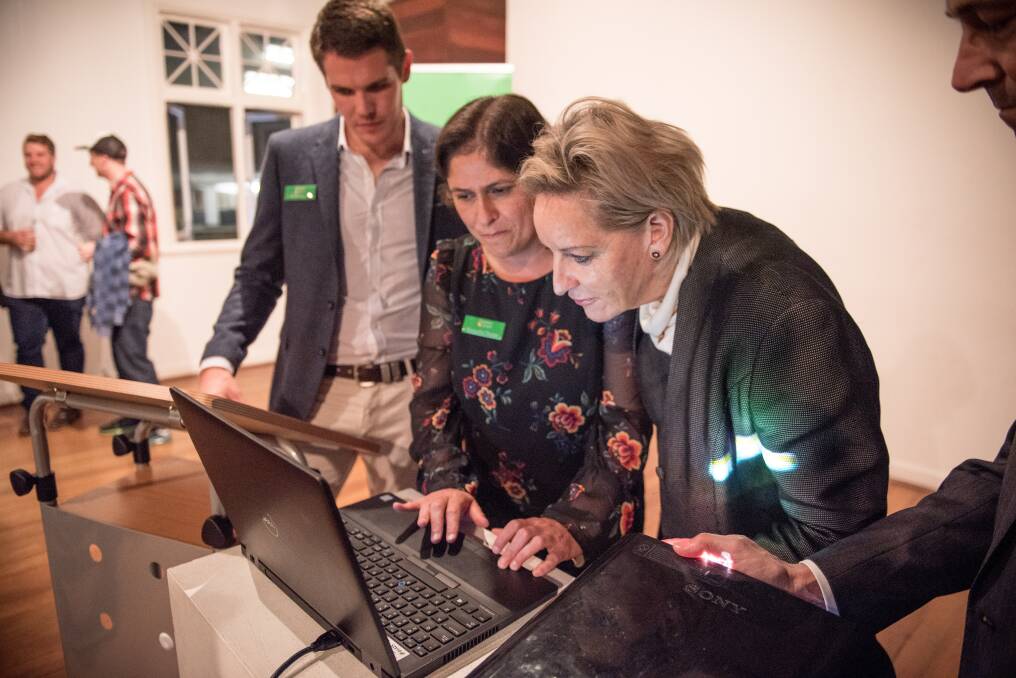 Careers in Grain communications officer Grant Taylor (left) and executive officer Manjusha Thorpe give Agriculture and Food Minister Alannah MacTiernan a guided tour of the new Careers in Grain website.