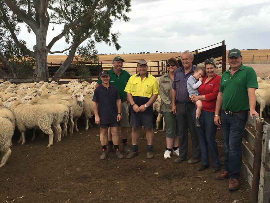 The Jensen family has handed over the reins of Uralla Prime SAMM stud to Tiarri Prime SAMM stud. Pictured together following the sale were Craig Jensen (left), Garry Prater, Landmark Lake Grace, Peter Jensen, Tiarri's Pauline and Ross Taylor and Kelly-Anne Gooch holding Bryce Carruthers with Roy Addis, Landmark Breeding.