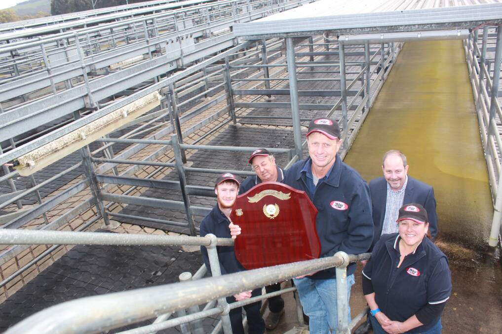  Mount Barker Regional Saleyards manager Stewart Smith (front), with the perpetual shield awarded to the saleyards for winning of the National Award for Animal Welfare in Saleyards and Lairages. With Stewart were saleyard staff Brodie Mann (left) and Simon Baxter, Shire of Plantagenet deputy chief executive John Fathers and saleyards assistant manager Erika Henderson.