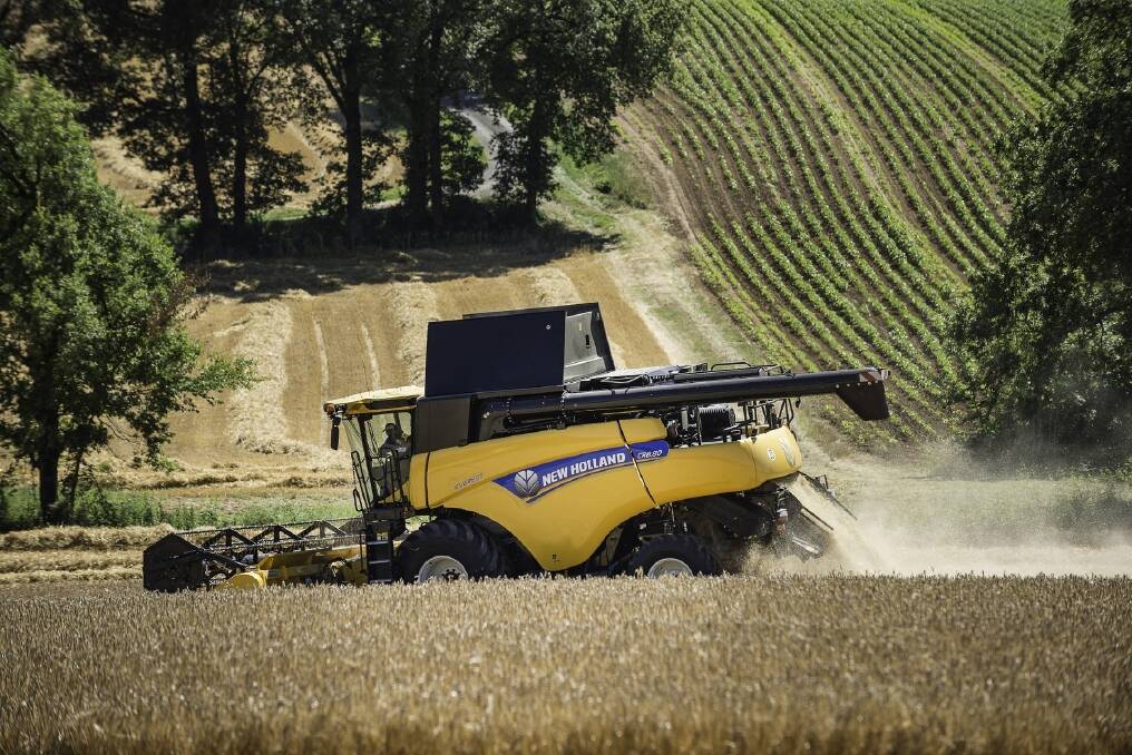 A New Holland 8.90 combine harvester in action... there's more to headers than high horsepower.