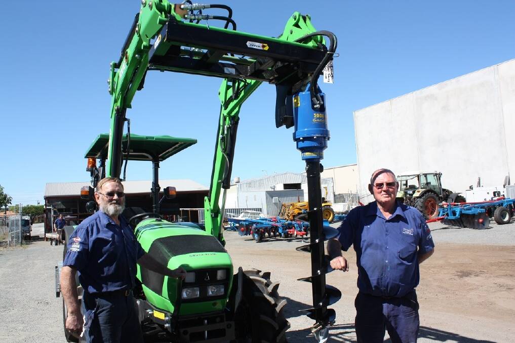 Fred Hopkins WA employees Allan Dudney (left) and Ed Flight, assemble a hydraulic auger on a Deutz Agrolux 310 front-end loader as part of a pre-delivery check before being transported to a customer. According to Fred Hopkins WA dealer principal Gary Johnson, there's more interest in front-mounted augers, mainly for ease of operation and safety.