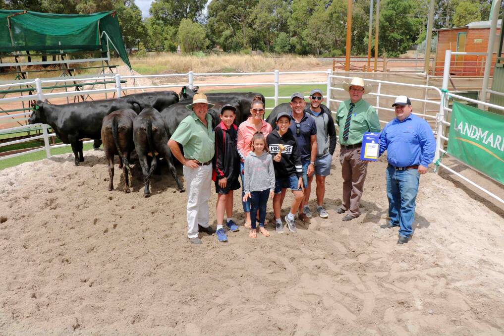  The top heifers and the happy vendors. Pictured here were Landmark Brunswick agent Errol Gardiner (left), with Cameron, Lauren, Eva, Nathan, Charlie and Julien Italiano, Landmark auctioneer Tiny Holly and Jarvis Polglaze holding the Zoetis trophy.