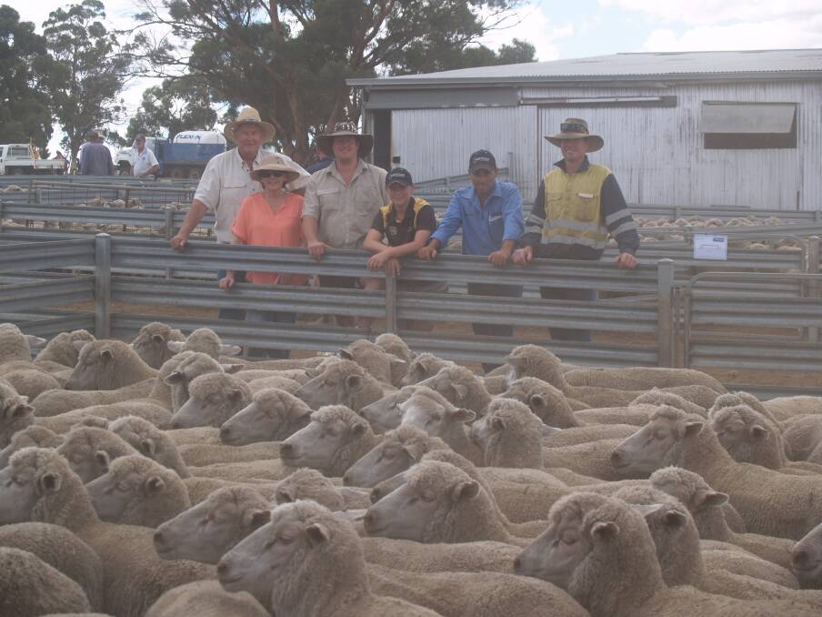  Looking over some of the line of 284 black tag ewes which topped the sale at $162 were vendors Geoff (left), Helen and Cameron Beeck and Cameron's son William, Westcoast Wool & Livestock's Brad Preston and the buyer of the line Wayne Crook, Coolangatta Trust, Kojonup.