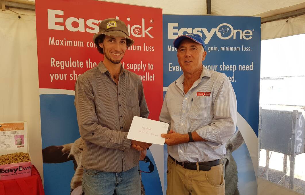 Peter Cumming (left), Wagin, winner of four tonnes of EasyOne pellets at the recent Feeding Field Days run by Milne Feeds in conjunction with Advantage Feeders, was presented with his prize by Reg Crabb from Milne Feeds.