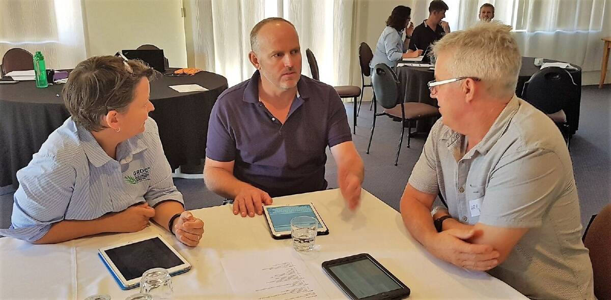  Discussing high priority grower issues at a recent Rregional Cropping Solutions Network meeting were GRDC grower relations manager - west, Jo Wheeler (left) and Kwinana West RCSN representatives Jon Hasson, Ballidu, and Gary Lang, Wickepin. Photo by Julianne Hill.