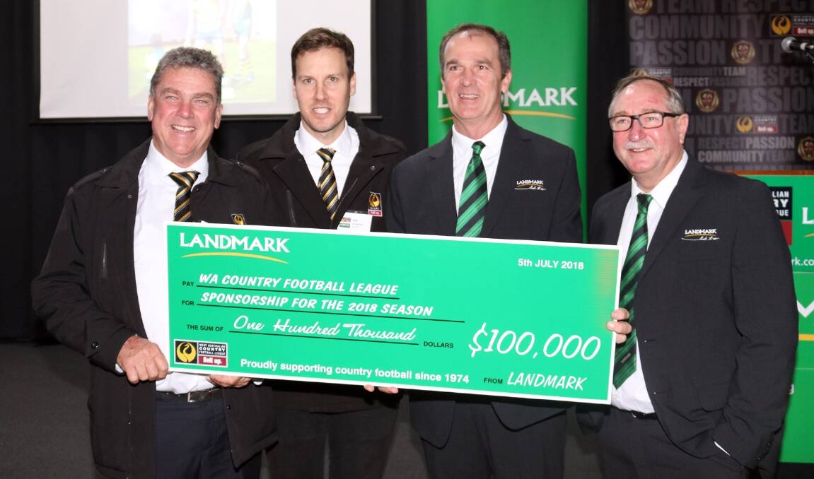  WA Country Football League president John Shadbolt (left) and WACFL general manager Joe Georgiades receive a $100,000 sponsorship cheque from general manager (North WA) David Rogers and Landmark key account manager Steve Wright.