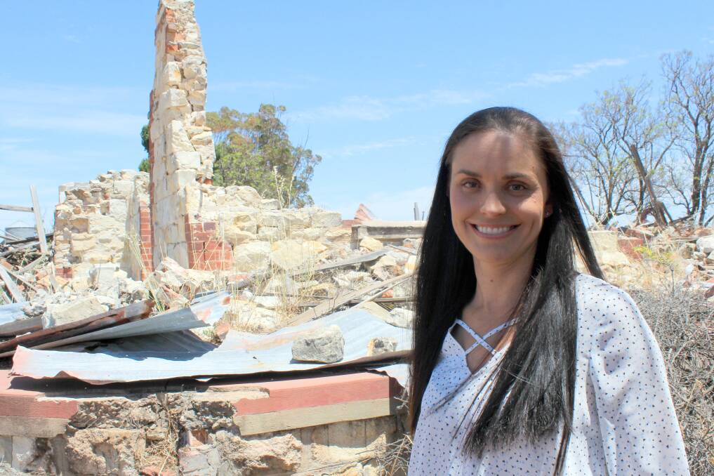 Rebekah Burges, one of the driving forces behind the Meckering Earthquake 50th anniversary, stands in front of the Snooke family home that was destroyed by the quake in 1968.