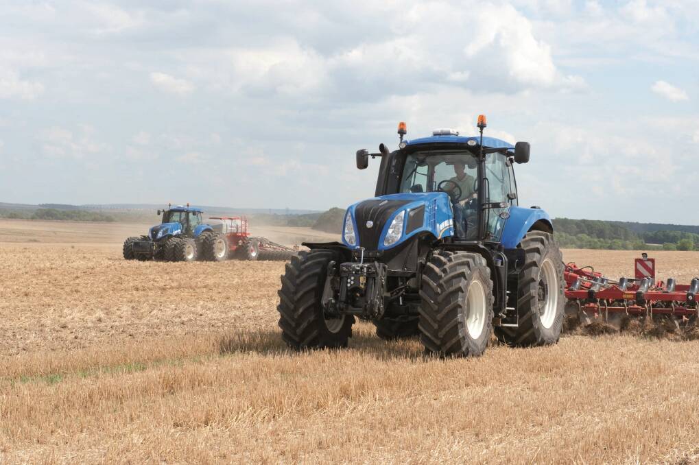 A New Holland T8 Series tractor is action. New Holland claims these models, also available with Smart Trax, are the most powerful tractors of their class in the world.