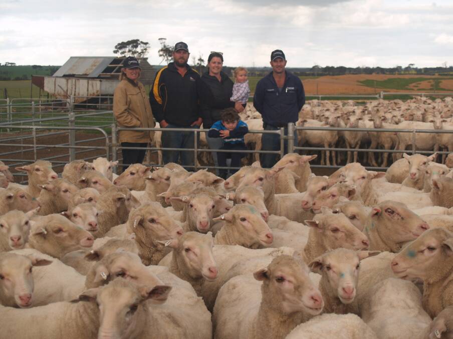 The Stacey family, Maroondah Farms, Yealering, will offer a draft of 400 white tag, August shorn, Ronern blood ewes in the sale. Looking over some of the ewes are Westcoast Wool & Livestock Lake Grace representative Jane Bushby (left), vendors Dave and Veronica Stacey and their children Hamish and Neah and  Westcoast Wool & Livestock Yealering representative Slim Davey.