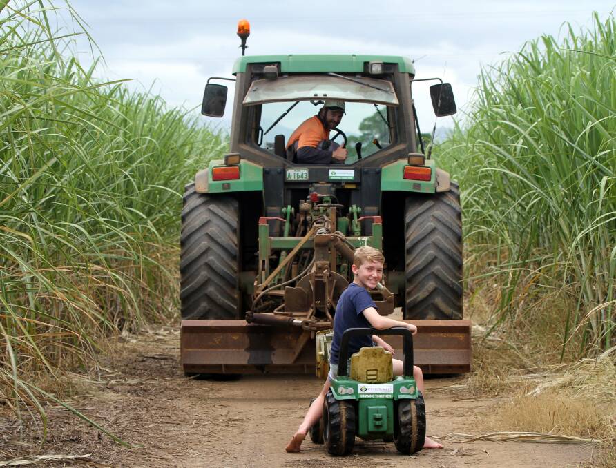 CRUSHING DELAY: Innisfail cane grower Adrian Darveniza and son Hamish are looking forward to the start of the cane harvest in the North.