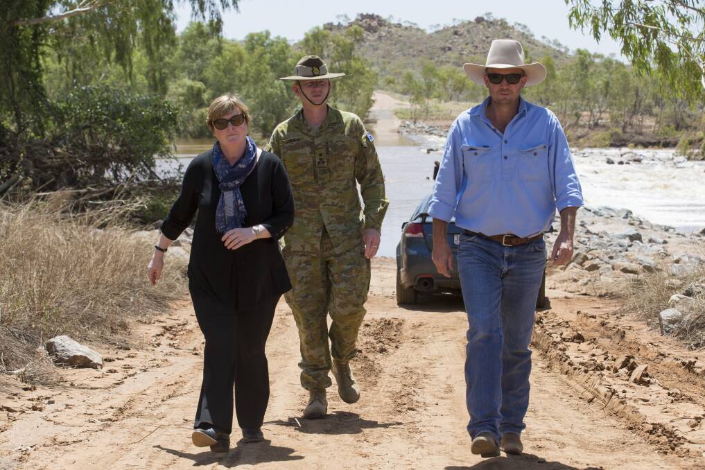 Commander of JTF646 Brigadier Stephen Jobson CSC and the Assistant Minister for Home Affairs, Senator the Hon.Linda Reynolds CSC inspecting flood damage with Cloncurry Mayor Greg Campbell following extensive flooding in north west Queensland.