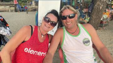 Holidaymakers Ange Roulestan and Kerstan Unsworth, of Tasmania, on Kuta beach, Bali. Picture: Donna Page
