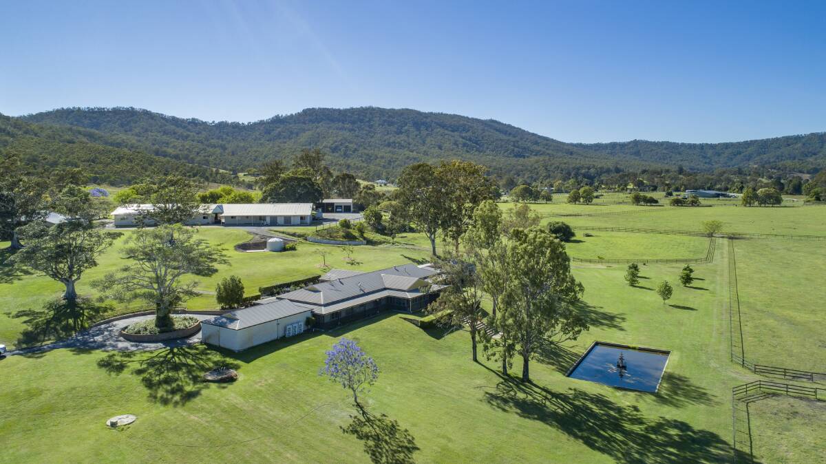 The north facing, six bedroom main homestead is set in acres of lush lawns and spectacular trees.