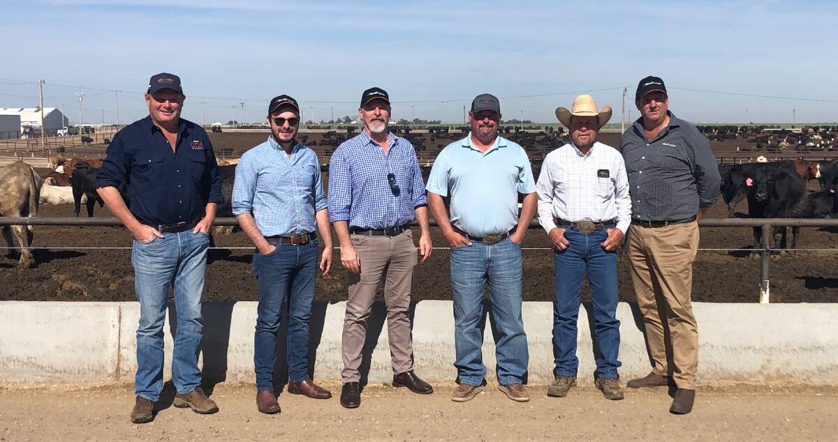 Finney County Feedyard manager Dave Pfenninger (second from right) hosting the Alltech Lienert Australia tour group.