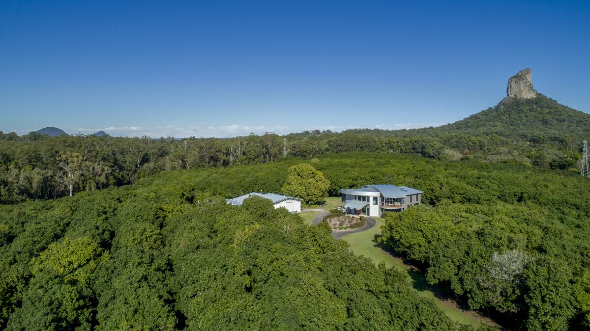 A Glass House macadamia farm with an architecturally designed home has made $2.14 million at auction.