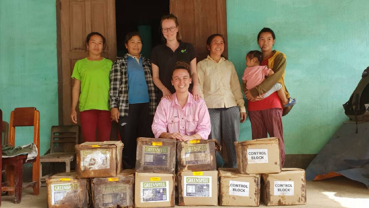 POVERTY BUSTERS: PhD student Nichola Calvani (centre back) with research assistant Francesca Earp (in pink) is managing a trial to control liver fluke in the Laos cattle herd.