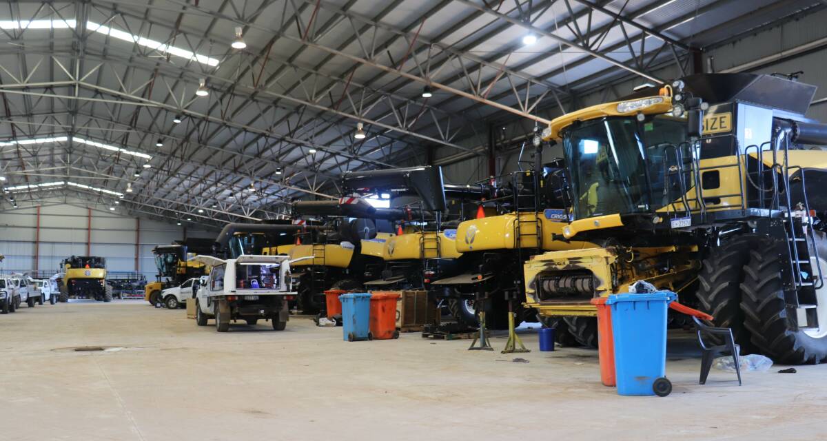 A line of new combine harvesters being fitted with Harrington Seed Destructors in the McIntosh & Son, Katanning, workshop before being delivered to clients.